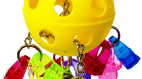 Colorful parrot toy featuring a yellow ball and multi-colored attachments, highlighting the best parrot toy Bonka Bird Toys.