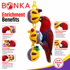 Red parrot playing with Bonka Bird Toys enrichment toy featuring colorful beads and interactive balls for mental stimulation and healthy activity.