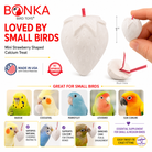 Mini strawberry-shaped calcium bird toy for small parrots, white with red stem, satisfies chewing instincts